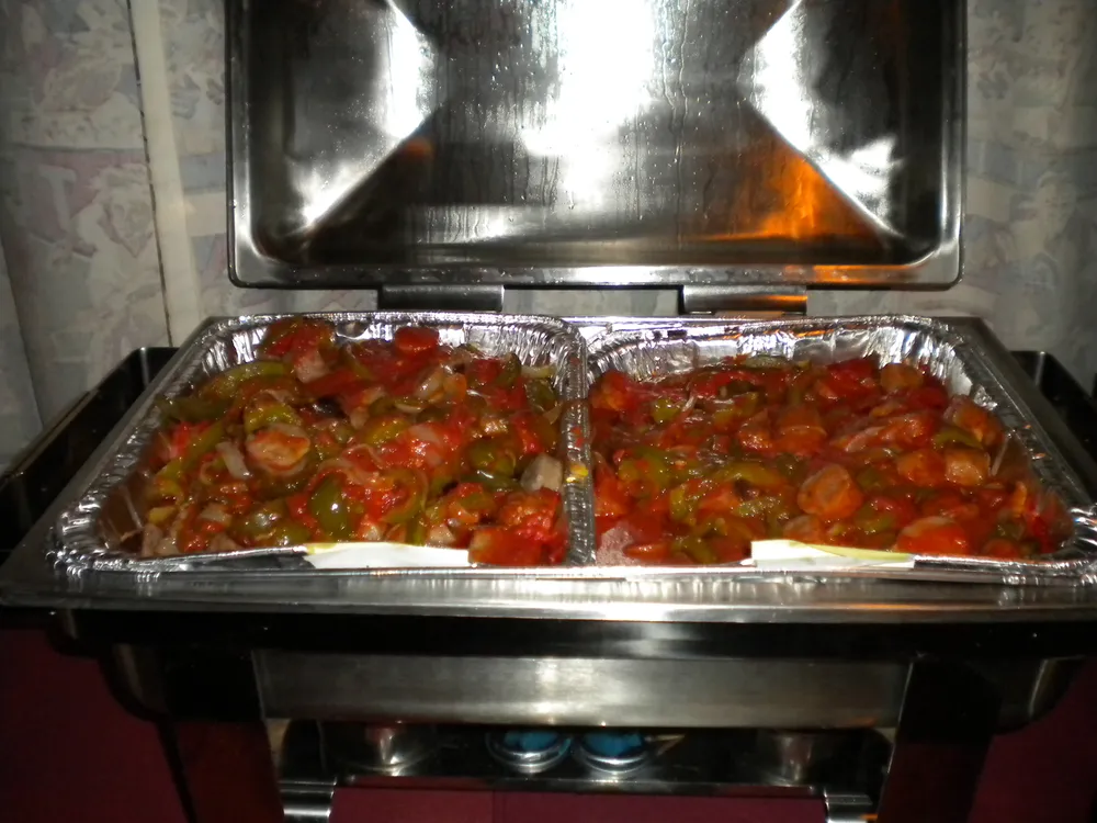 Eggplant Parmesan in a buffet chafing dish