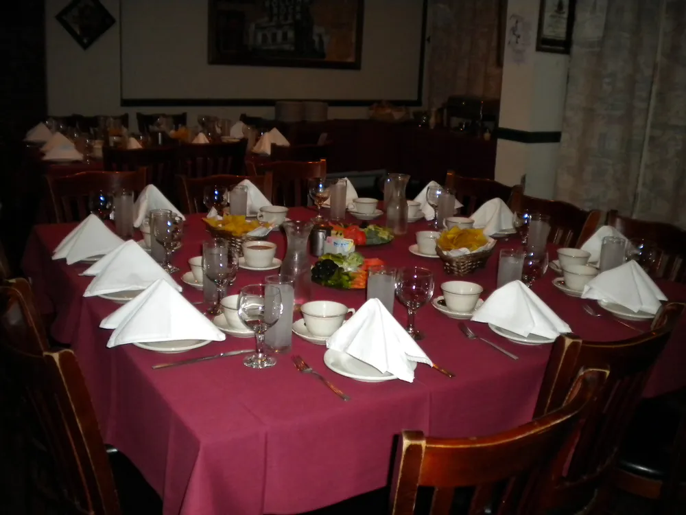 Private party room set with tables and napkins